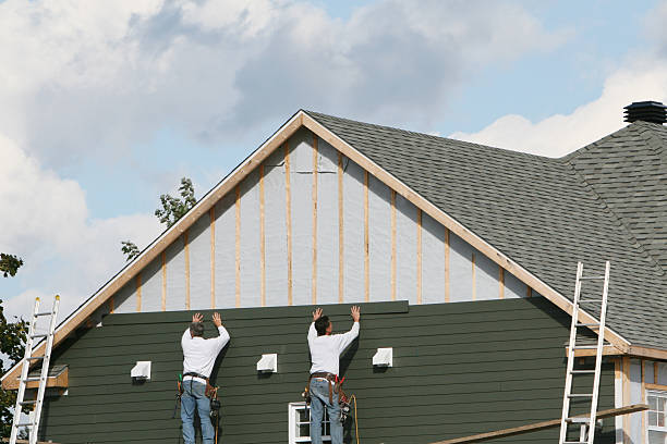 Professional Storm Damage Siding Repair technician working in Troy, NC